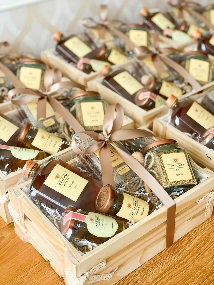 Wooden crate hampers with jars and ribbon, packed for a wedding