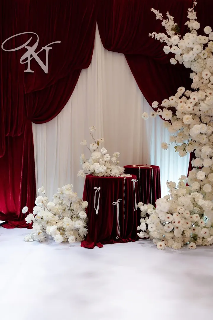 Velvet drape backdrop with white florals